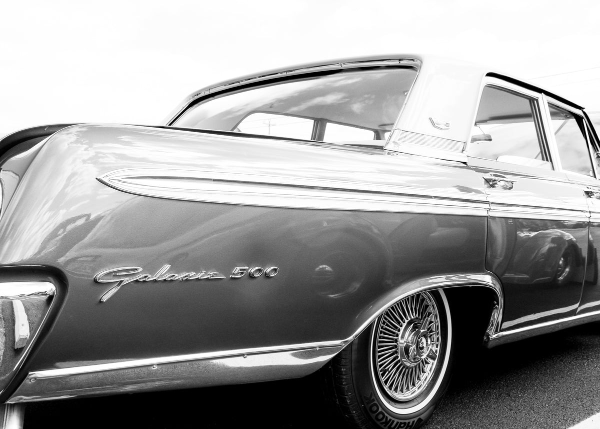 Galaxie 500 — black and white fine art automotive print by DC Ward, close-up of classic Ford Galaxie 500 badge and rear quarter pane